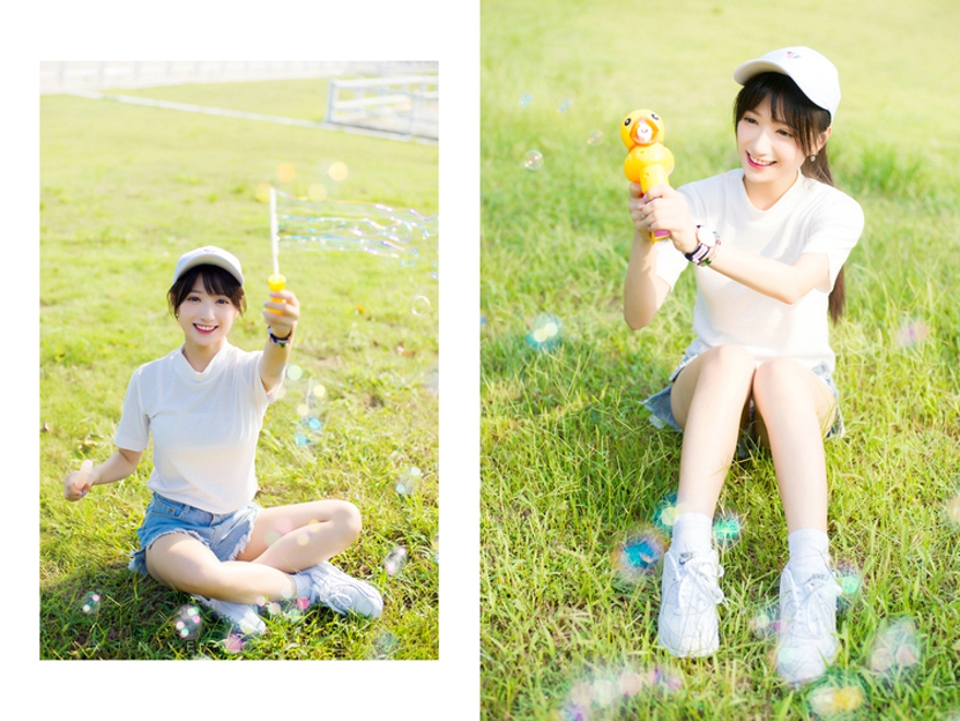 坐在草坪上吹泡泡清纯美女阳光气质写真照片