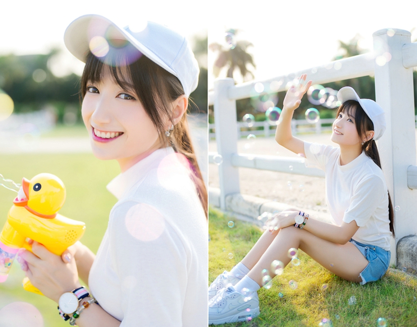 坐在草坪上吹泡泡清纯美女阳光气质写真照片